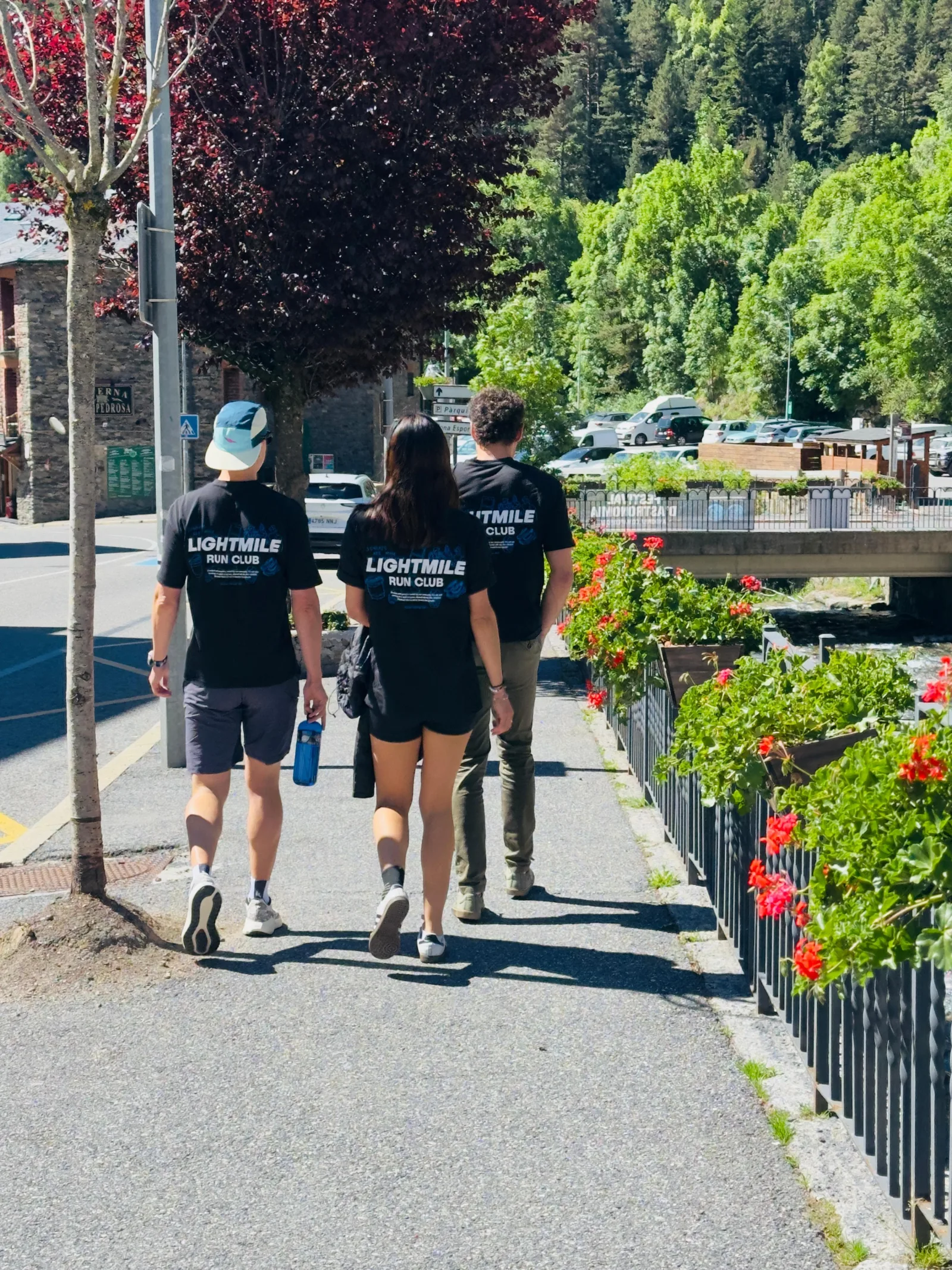 Three Lightmile members walking together on a sunny trip
